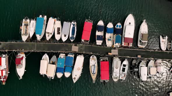 Drone top down view of marina harbor many colorful boats authentic ships fishing boats