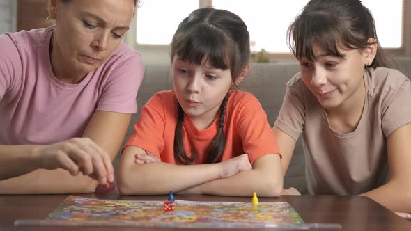 Family playing table game. 