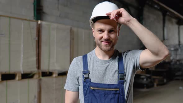 Handsome and Happy Professional Worker in Hat Charmingly Smiling on Camera