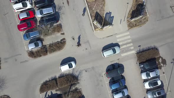 Top aerial view of many cars on a parking lot or sale car dealer market.