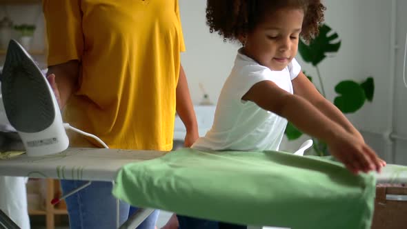 Daughter Help African American Mother to Iron Pillowcase in Modern Living Room Ironing Board Spbd