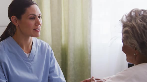 Nurse helping a senior woman in a retirement home