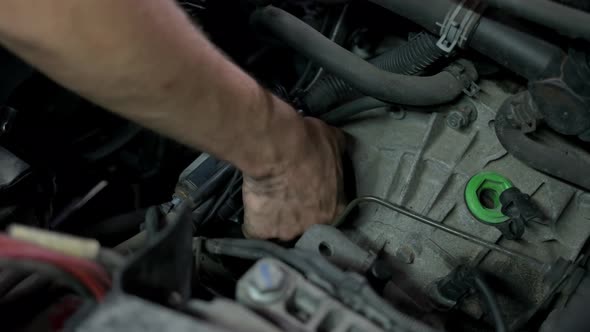 Close Up Male Hand Fixing Car Engine