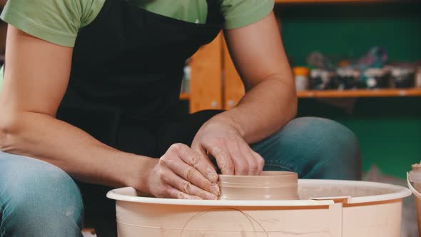 Pottery - the Master Is Raising the Walls of the Clay Bowl on the Potter's Wheel