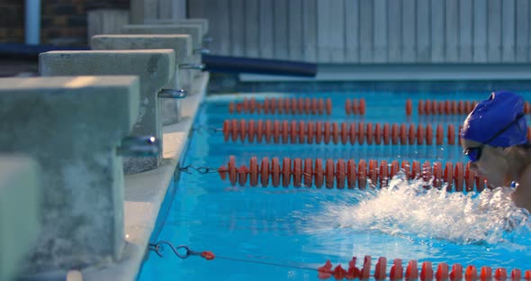 Female swimmer cheer at finishing line of swimming pool 4k