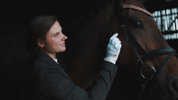 Girl Touching Her Seal Brown Horse Stroking The Horse And Expressing Her Love