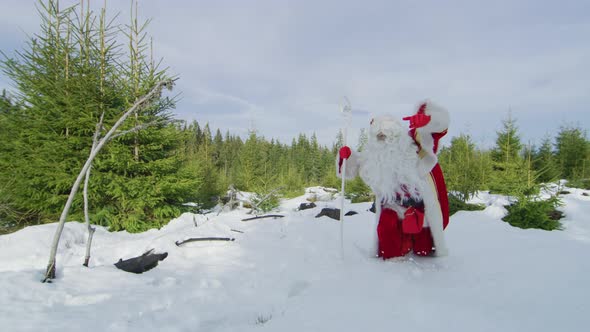 Santa Claus barely walking in the snow