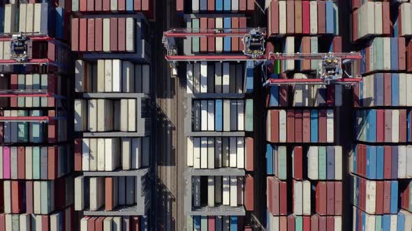 Cargo containers in busy port, aerial. Drone shot. 