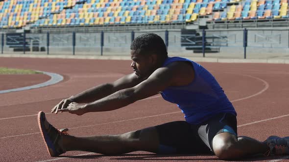 Young Teacher Showing Students Various Stretching Exercises Physical Education