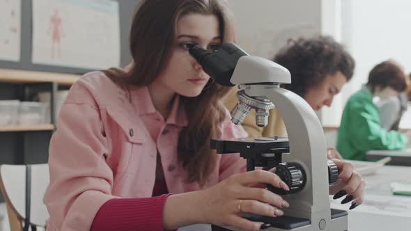 Girl Using Microscope