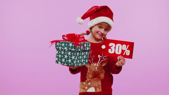 Toddler Girl in Christmas Hat Showing Gift Boxes and 30 Percent Discount Inscriptions Banner Text