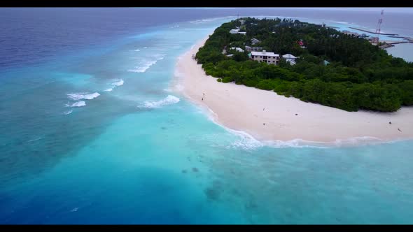 Aerial drone scenery of relaxing seashore beach journey by turquoise lagoon with white sandy backgro