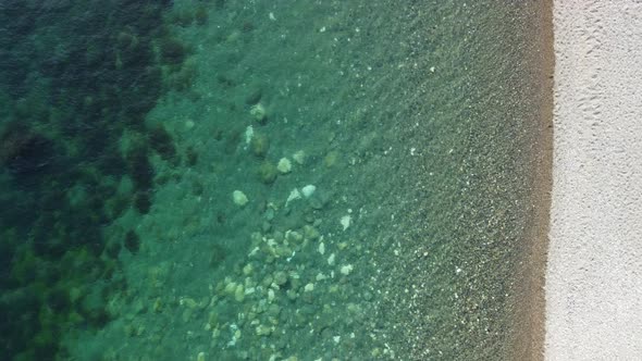 Aerial View on Calm Azure Sea and Volcanic Rocky Shores