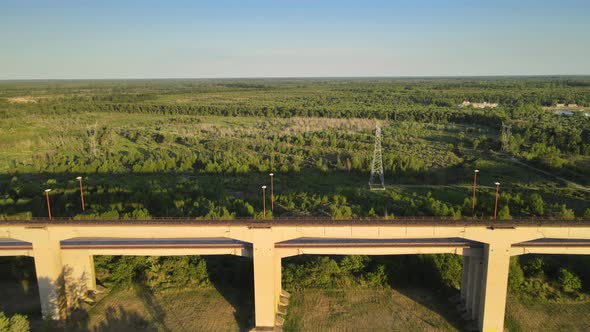 Dolly in flying over Zarate Brazo Largo road and railway complex cable-stayed bridge and Entre Rios