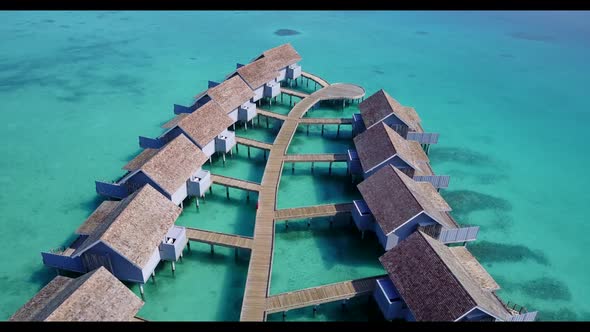 Aerial view seascape of paradise shore beach trip by blue lagoon and white sandy background of a day