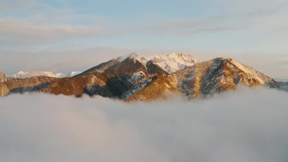 Cliffs at sunrise with clouds Impressive view of steep rocky mountains Eastern Sayan Siberia Arshan