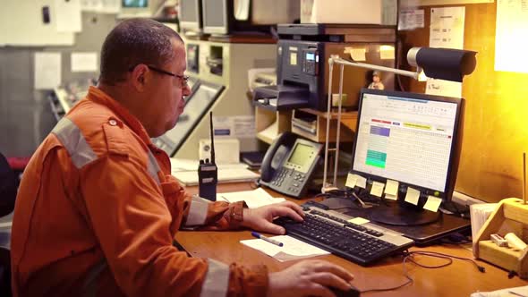 Marine Engineer Officer Working in Engine Room