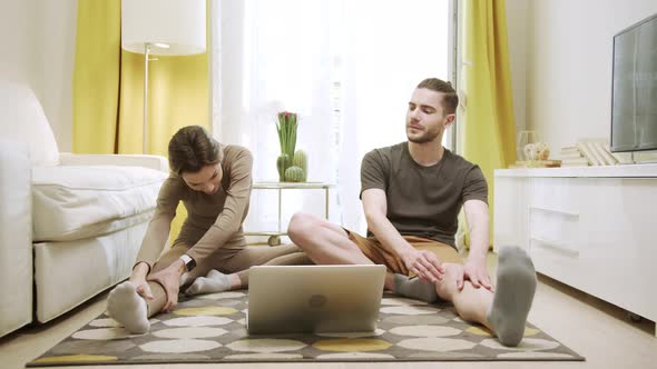 Two Friends are Doing Stretch Exercises