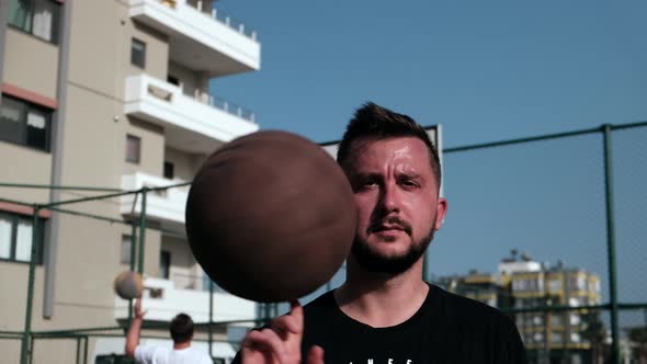 Man Spins Basketball on His Finger