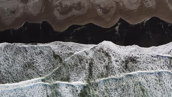 Overhead Shot Of Tide Coming In Over Beach