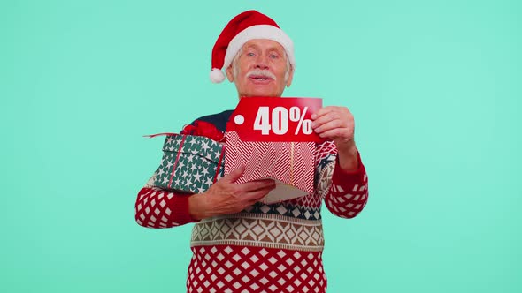 Grandfather in Christmas Sweater Showing Gift Box and 40 Percent Discount Inscriptions Banner Text