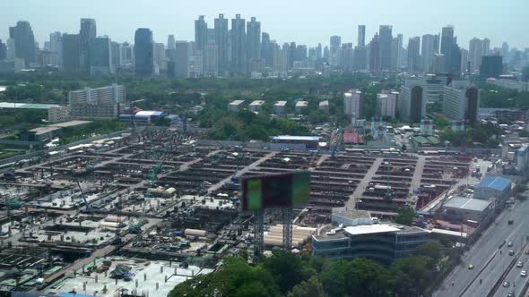 Panoramic view of cityscape and construction site in metropolis