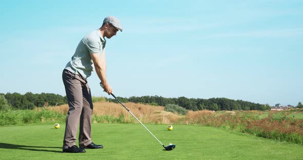 Luxury Hobby. Young Golf Player Playing at Outdoor Course, Hitting Ball