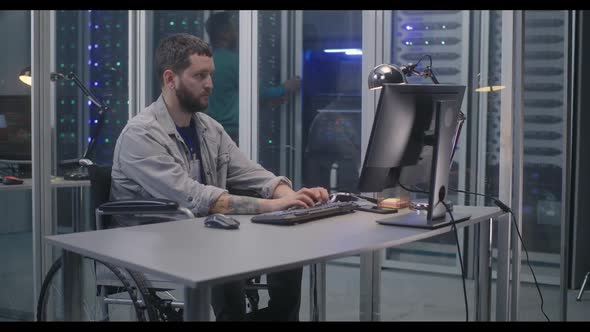 Wheelchaired Programmer Working in Data Center