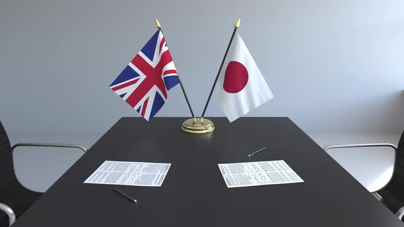 Flags of Great Britain and Japan and Papers