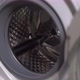 Woman Opens Door of Washing Machine Puts in Dirty Clothes and Takes Out Clothes - VideoHive Item for Sale