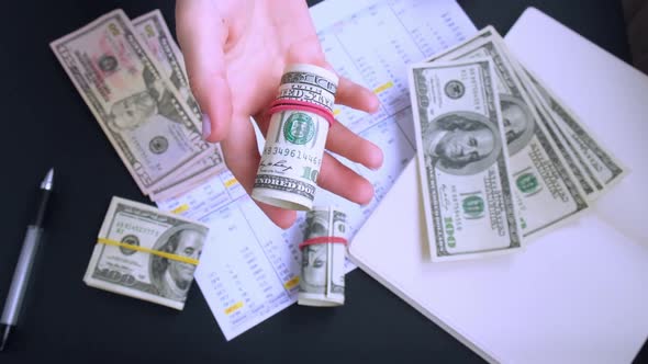 Business Woman Displaying a Spread of Cash US Dollars