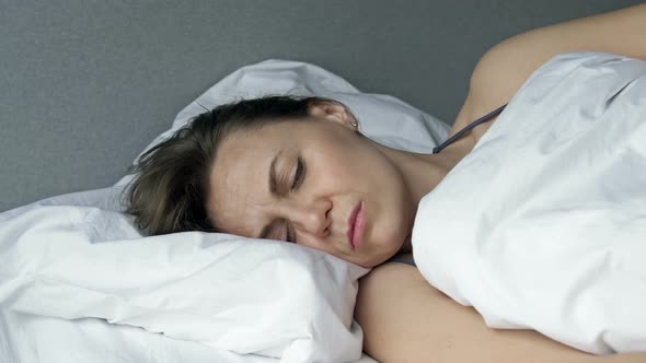 Tired Woman Cannot Sleep