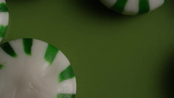 Rotating shot of spearmint hard candies - CANDY SPEARMINT 025