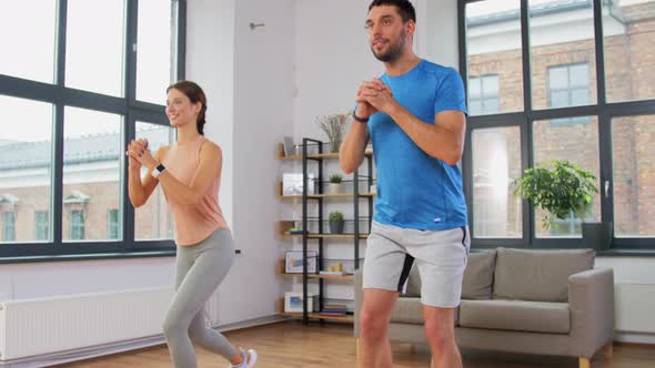 Couple Exercising and Doing Lunge at Home