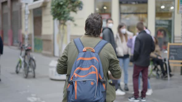 Back View of Man Walking Towards the Public to Show Magic Tricks