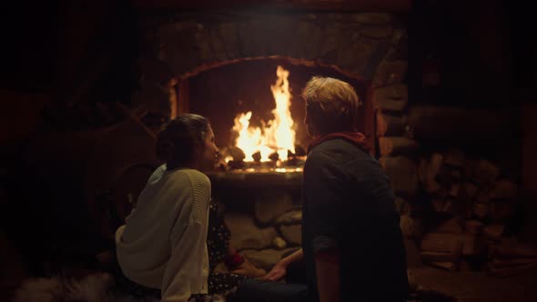 Romantic Couple Sitting Fireplace in Country House