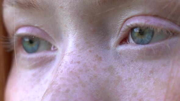 Beautiful Blue Eyes of a Redhead Girl Close Up