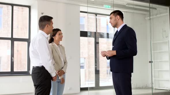 Realtor Giving Key To Customers at New Office 33