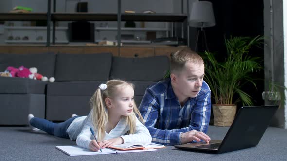 Dad Choosing on Lapatop Lessons for Preschool Girl