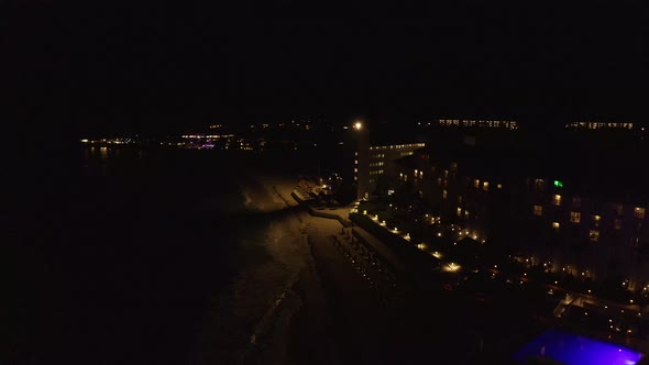 Aerial View of the Luxury Hotel at Night By the Se