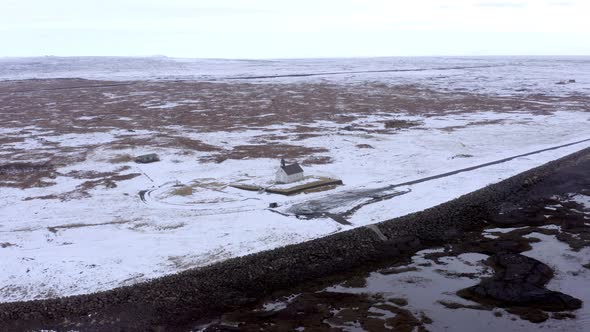 Secluded Church in Snowy Iceland on the Coast