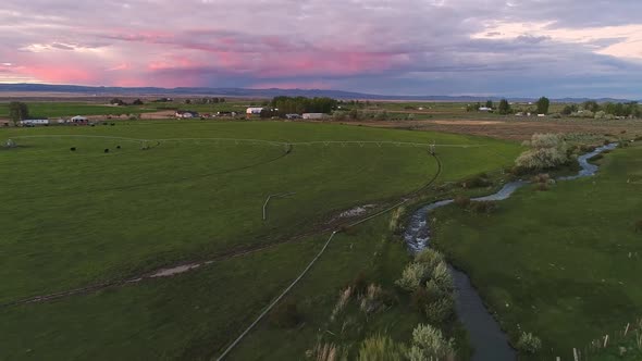 Aerial view over farmland in Idaho during colorful sunset