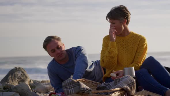 Couple enjoying free time by the sea