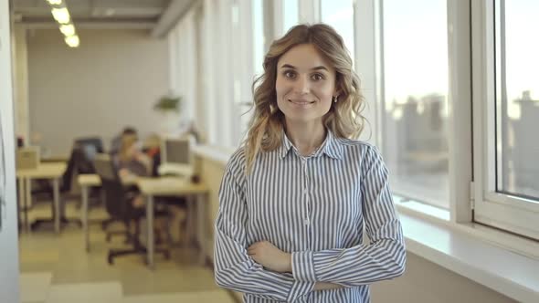 Portrait of American Businesswoman is Posing for Photo Standing in Modern Office