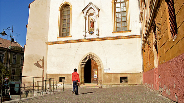 Woman Enters a Catholic Church
