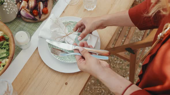 Putting Plates and Cutlery on Table