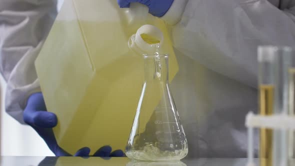 Research Laboratory Employee Takes Sample of Gasoline for Quality Tests, Slow-Mo