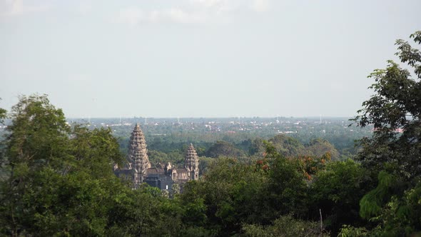 Wide Shot of Angkor Wat Behind the Trees