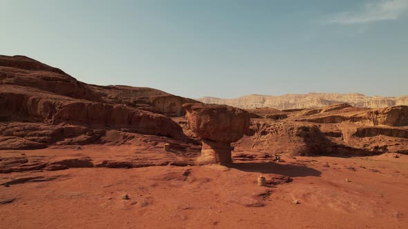 An interesting mushroom-like rock formation in the desert, filmed in Nature Park Timna, southern Isr