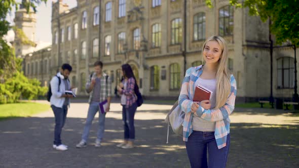 Cheerful Blonde Student Joyfully Smiling Looking at Camera, Quality Education